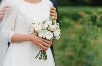 Details of the wedding morning. Wedding bouquet in the hands of the bride